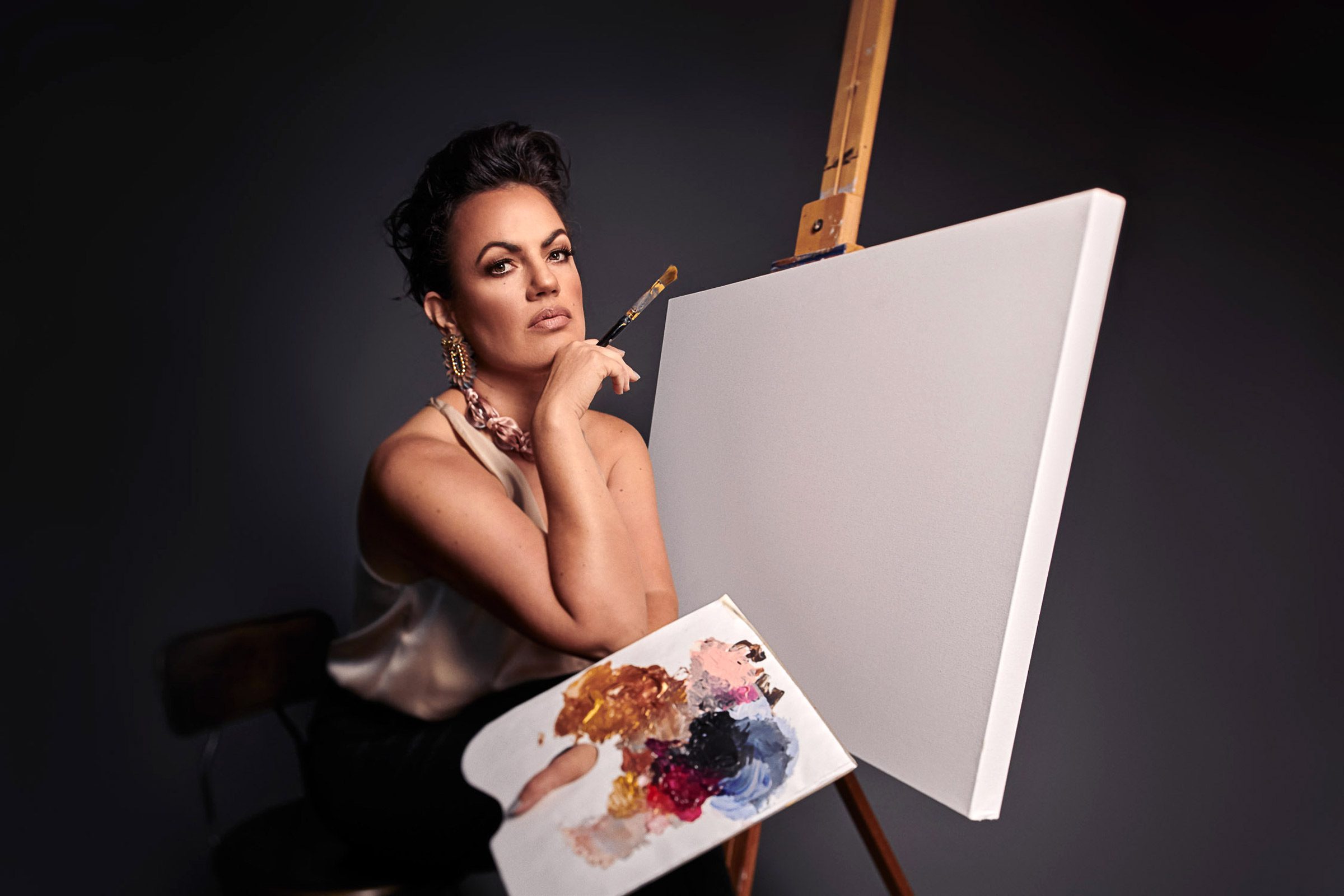 artist cindy scott sits at blank canvas