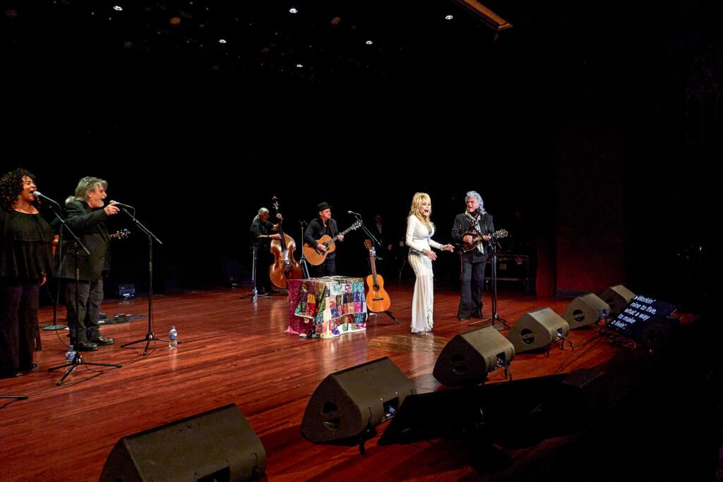 Dolly parton acknowledges the crowd after taking the stage at the Congress of Country Music.