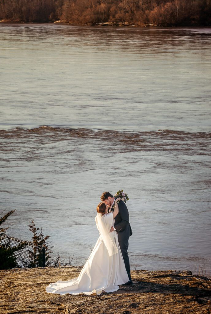 bride and groom kissing Hermann Hill Missouri River MO