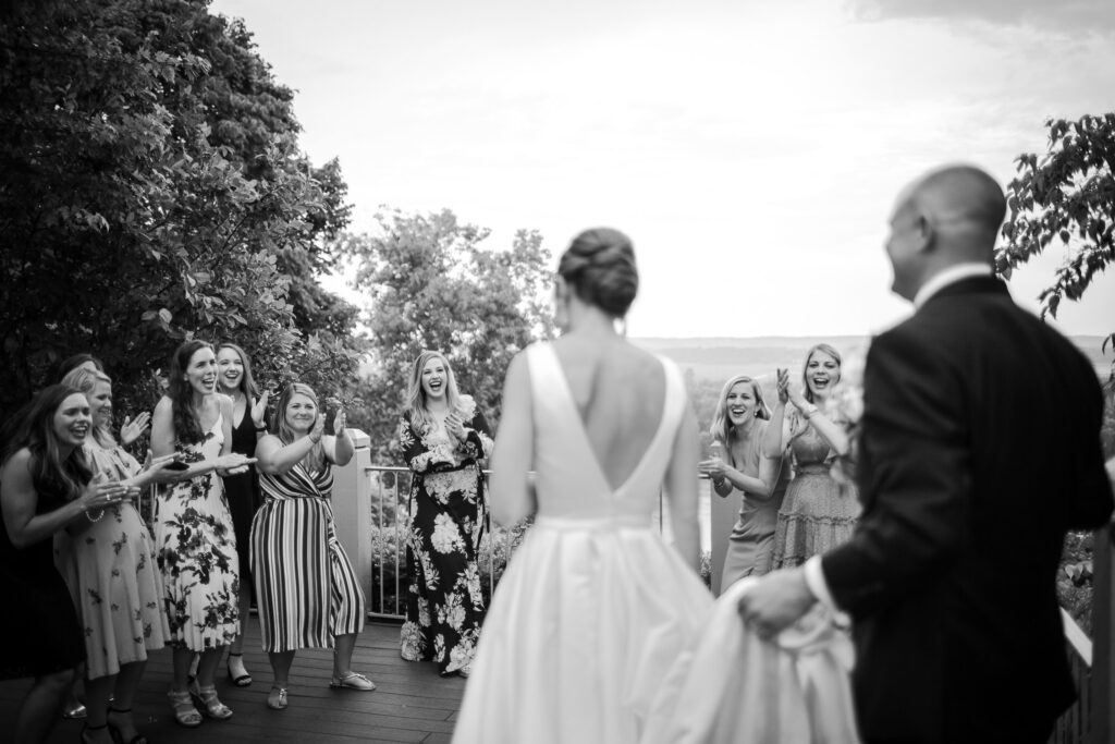 bride and groom walking up to smiling girls Washington, MO