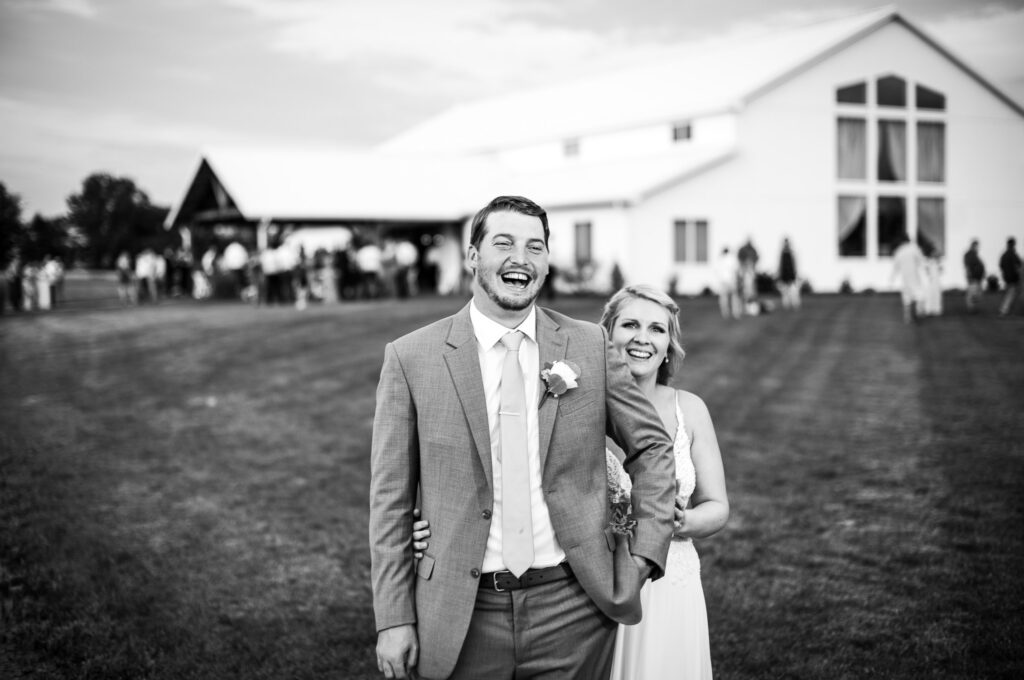 Bride and Groom strolling Emerson Fields Excello, MO