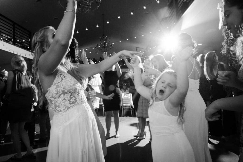 bride dancing with flower girl Emerson Fields Excello, MO