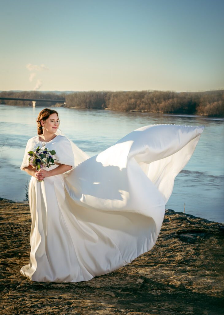 bride's dress flying in front of Hermann Hill Missouri River, MO