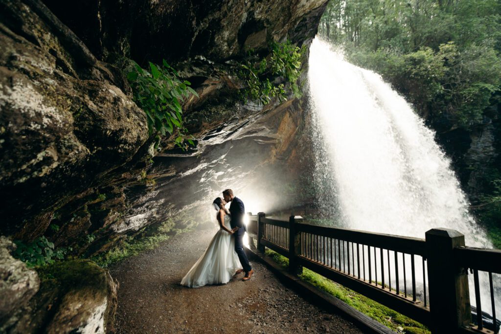 bride and groom at bridal veil falls franklin north carolina