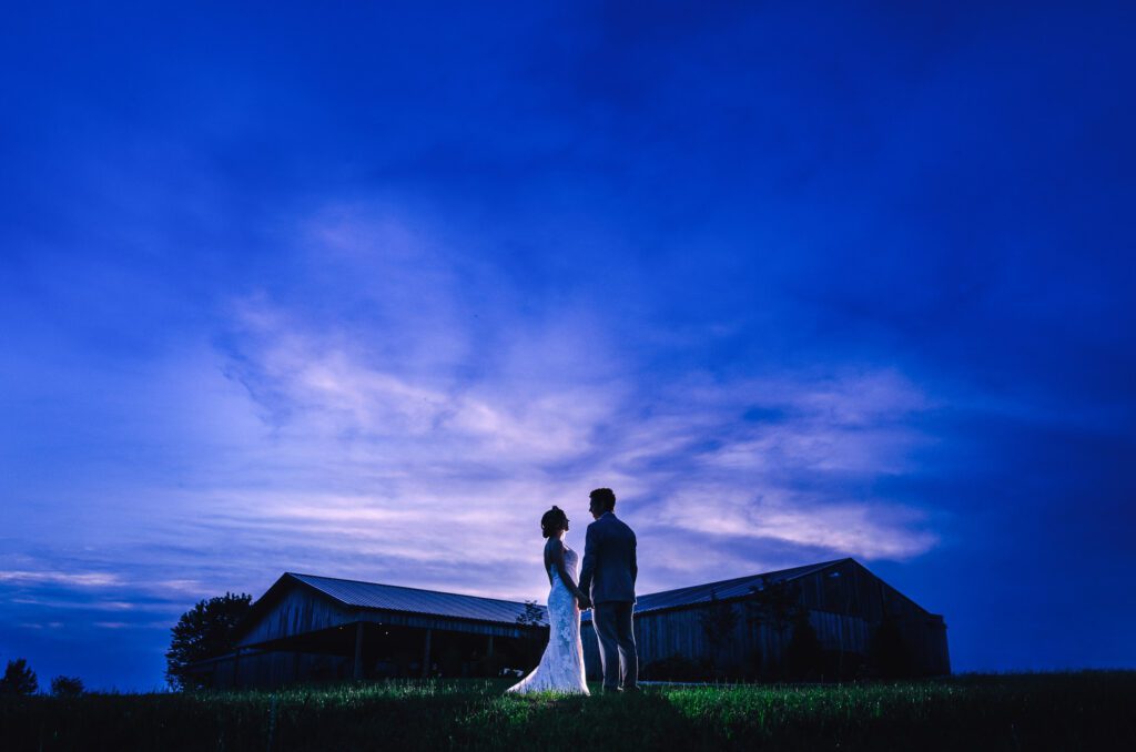 Bride and Groom against night sky wedding at Coopers Ridge