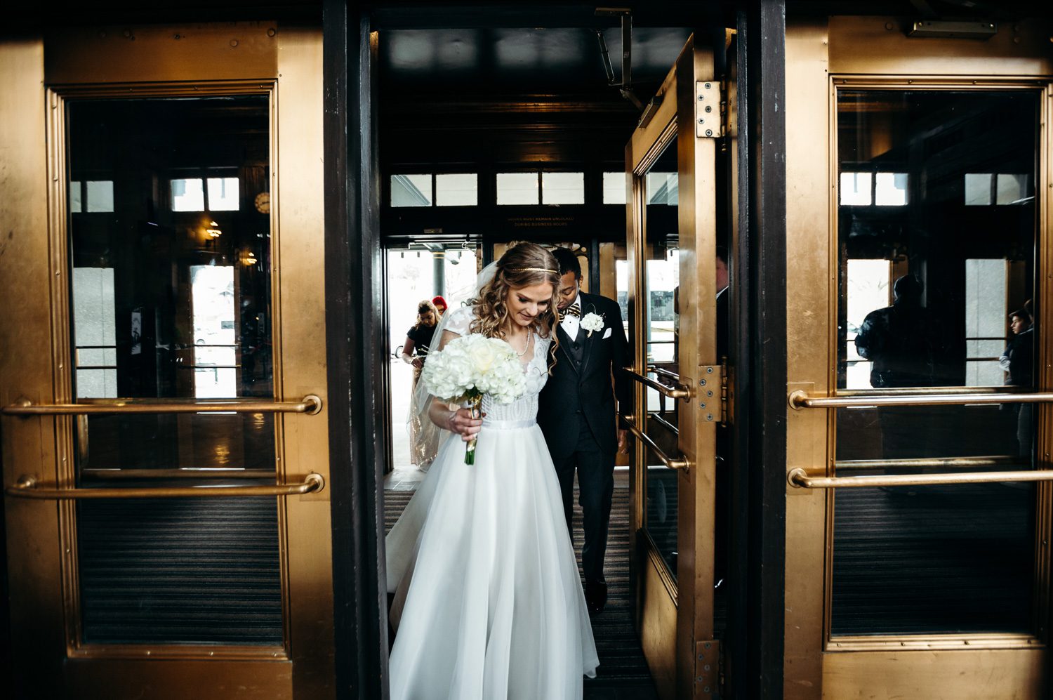 bride leading groom into union station kansas city