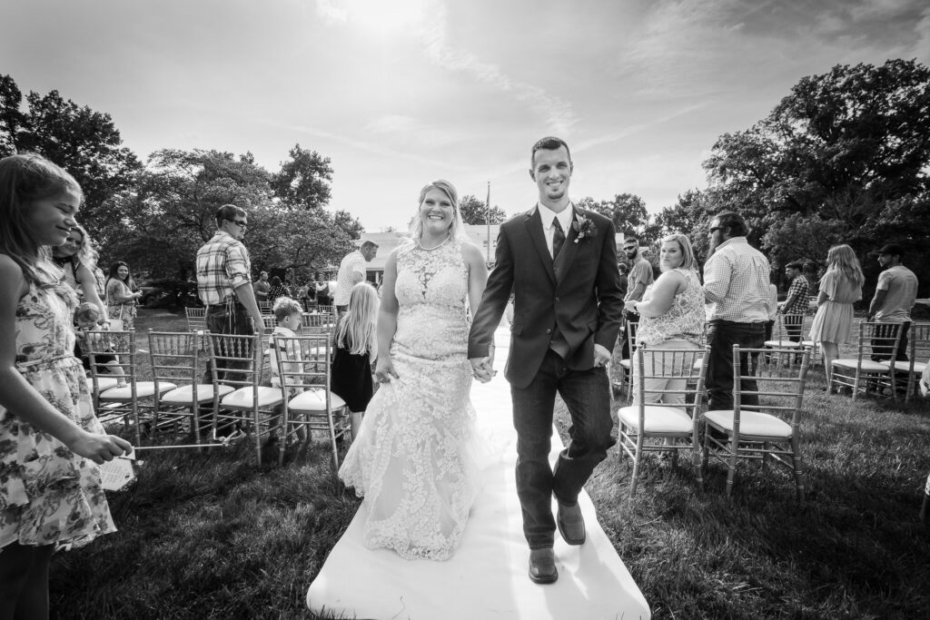 bride and groom exit down aisle Chatol House and Gardens Centralia, MO