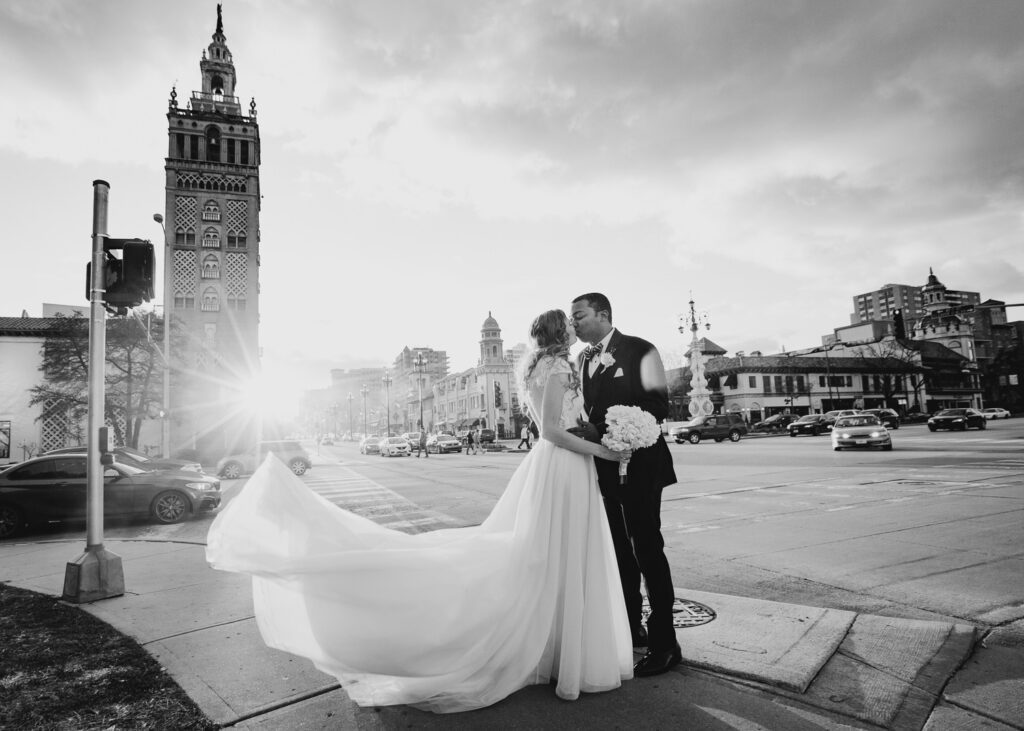 bride and groom kiss in kansas city plaza