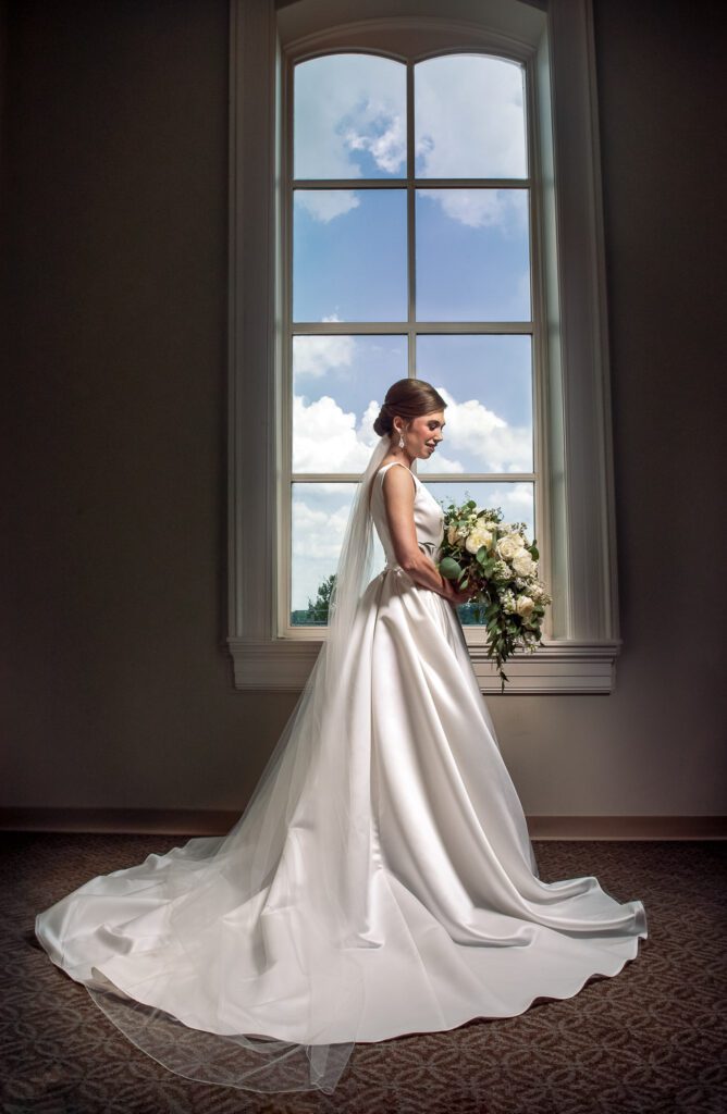 bride in front of clouds in window Washington, MO