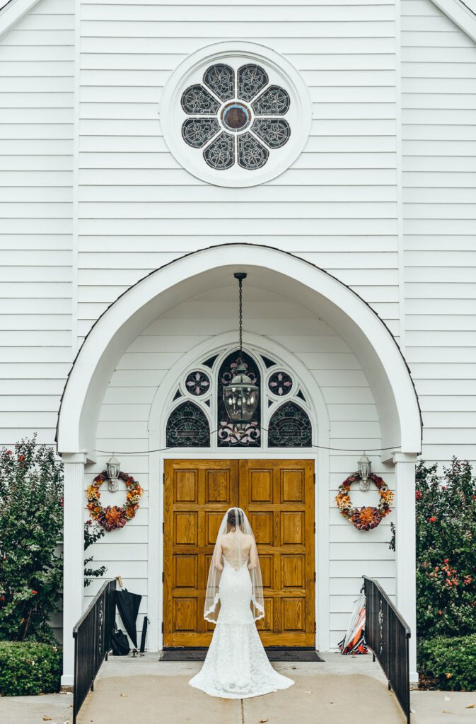 bride waiting to enter catholic church