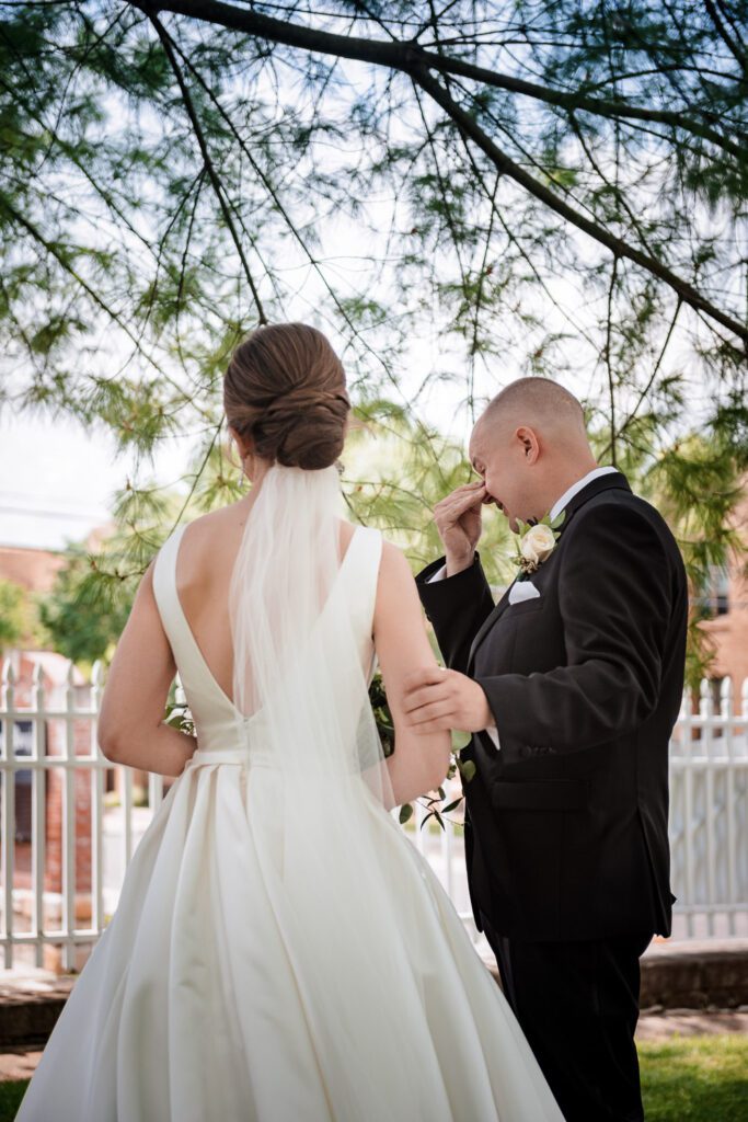 groom crying during first look with bride Washington, MO
