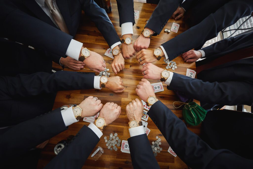 groomsmen with watches playing poker
