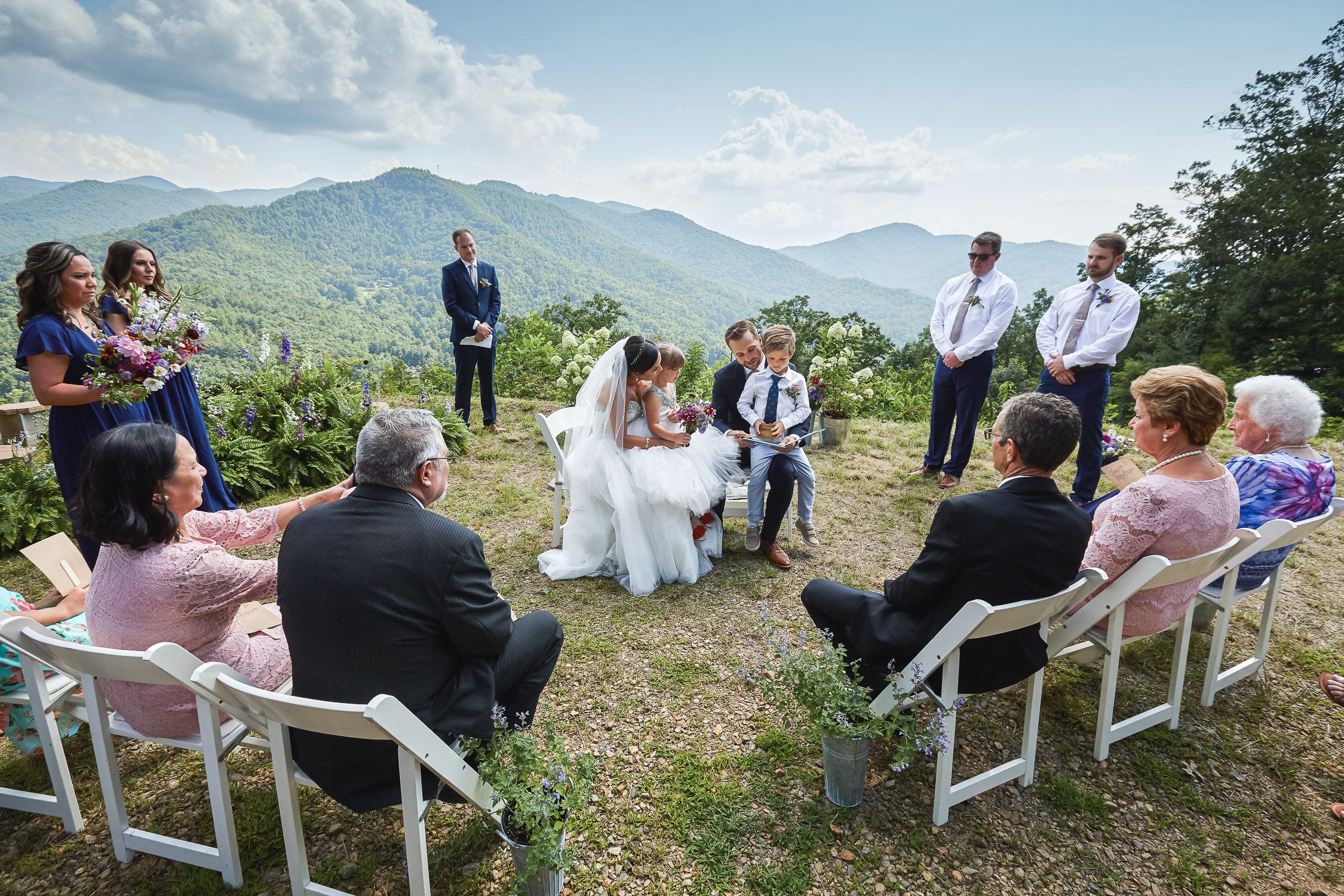 Bride and Groom reading to kids during ceremony North Carolina