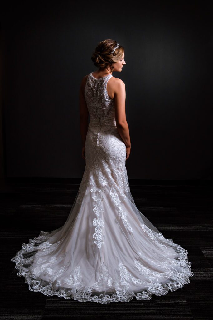 Bride showing wedding dress train