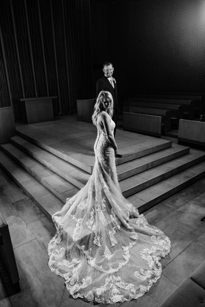 Bride walking up steps to groom