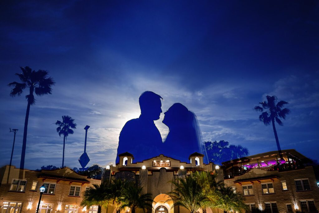 silhouette of couple over a hotel