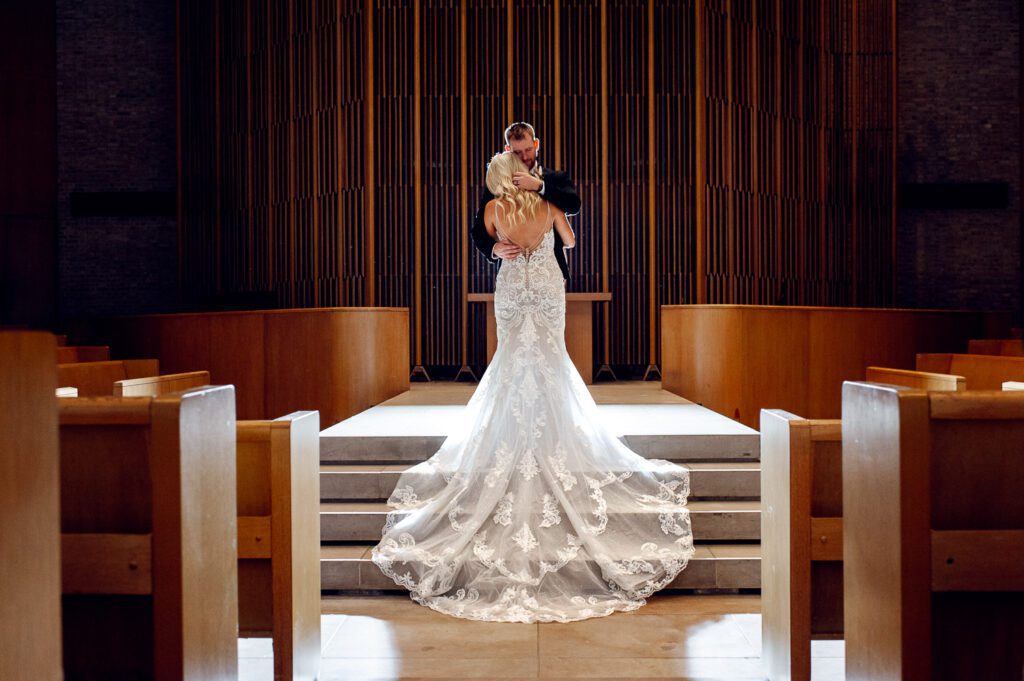 Groom holding bride on steps
