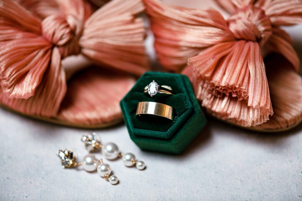 Pink bow shoes with wedding rings