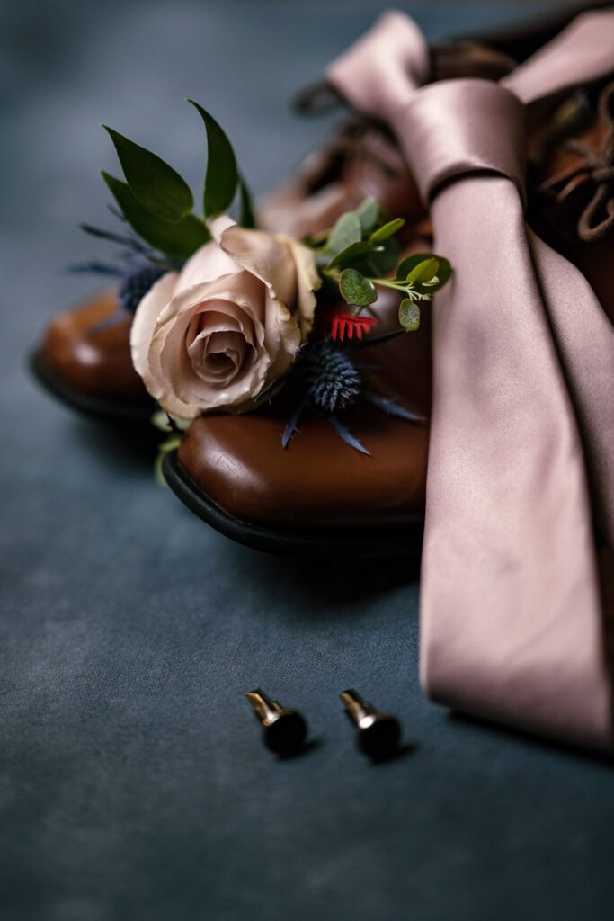 groom shoes and tie and flowers with cufflinks