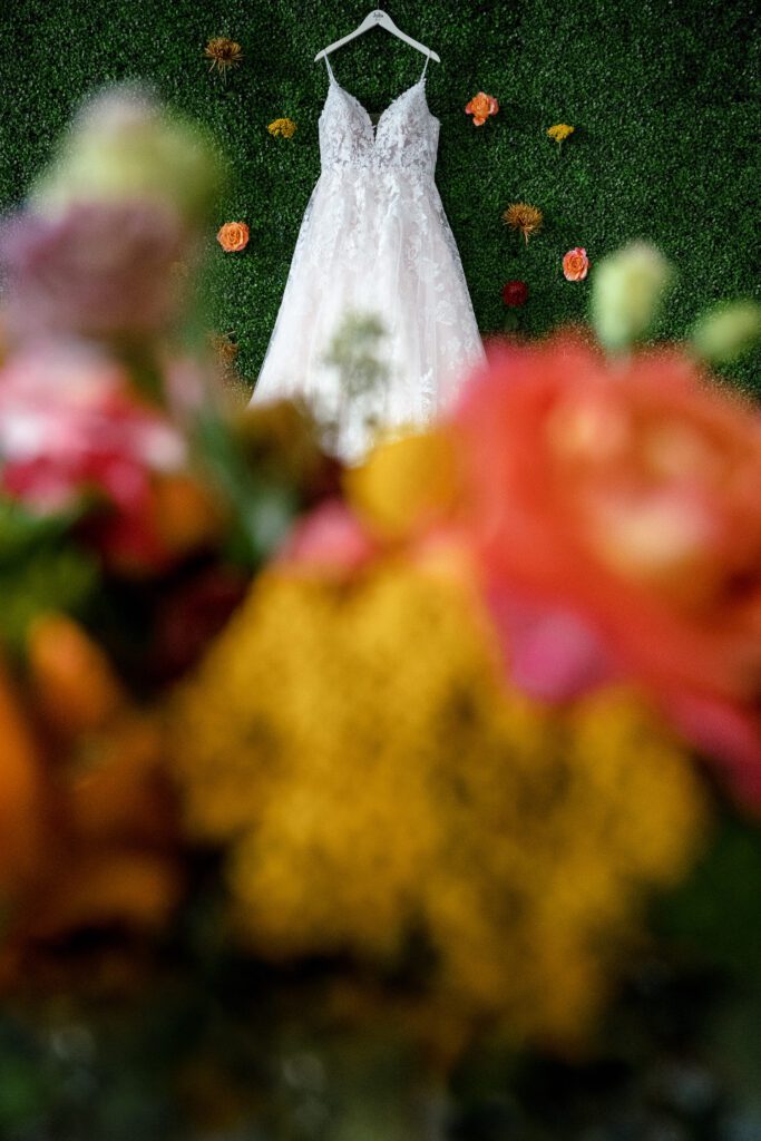 bridal gown on floral wall