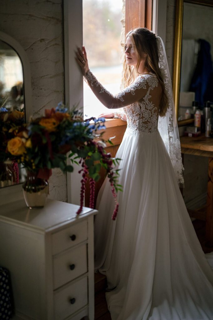 Bride in doorway with bouquet