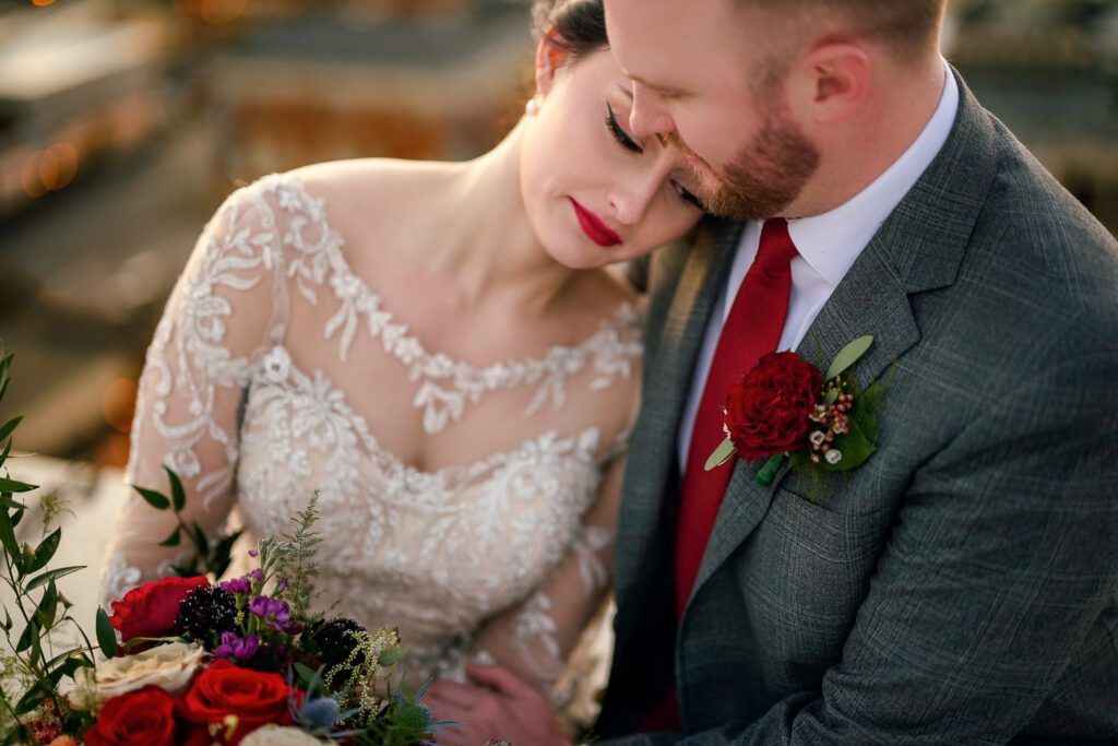 bride resting on grooms shoulder
