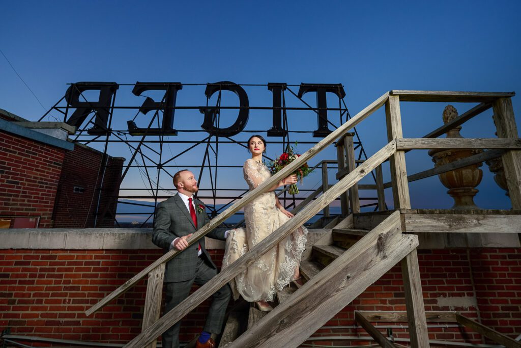 bride and groom climbing stairs