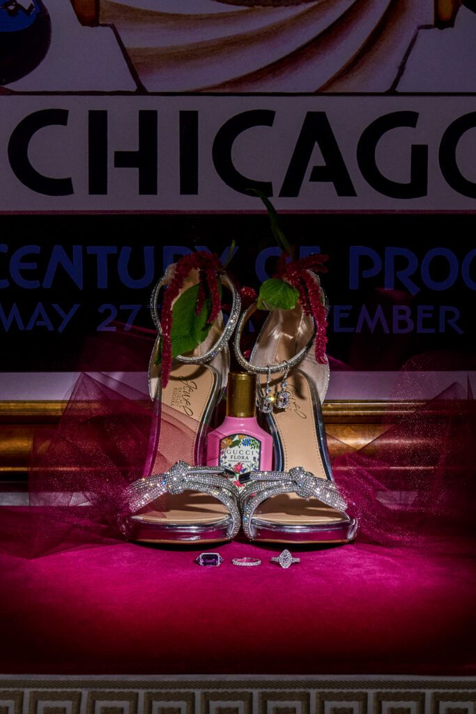 Chicago poster with shiny wedding shoes and rings