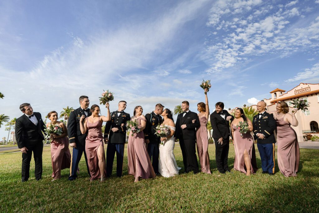 wedding party walking and laughing in pink dresses