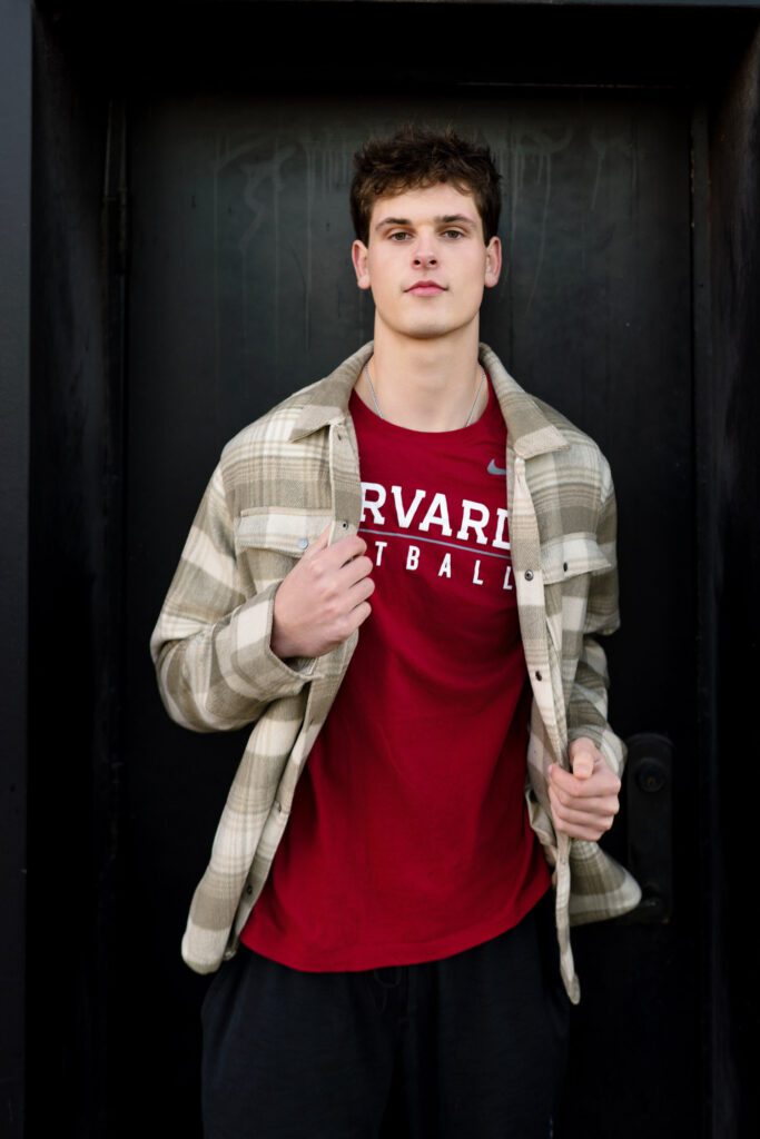 Senior sam kaiser wearing red harvard football tshirt