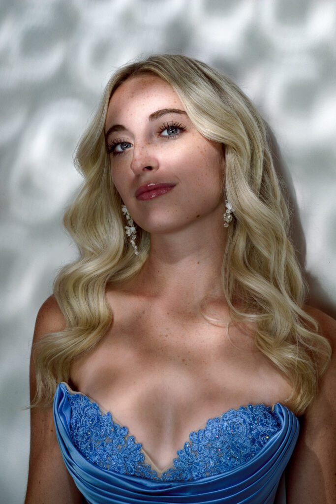 blonde senior girl with pattern of light reflecting