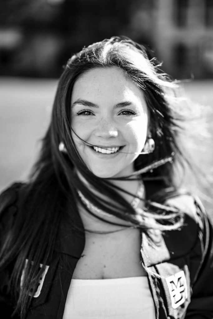 Wind blowing mizzou college senior girl hair