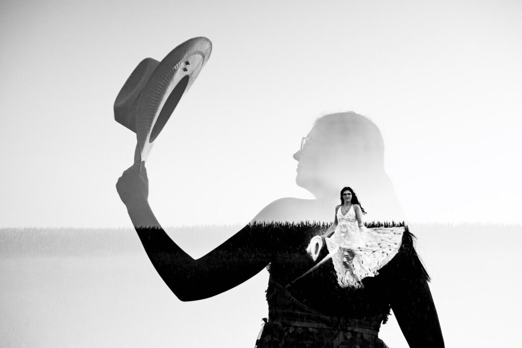 double exposure of senior girl wearing white lace dress in field