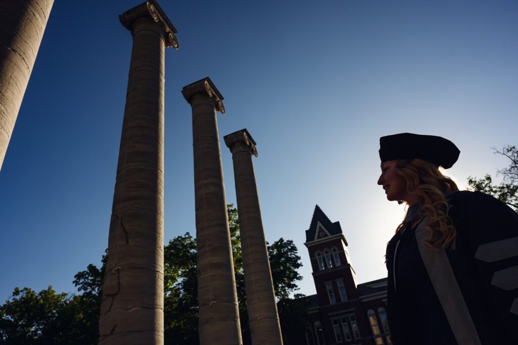 Graduate looking at Mizzou Columns