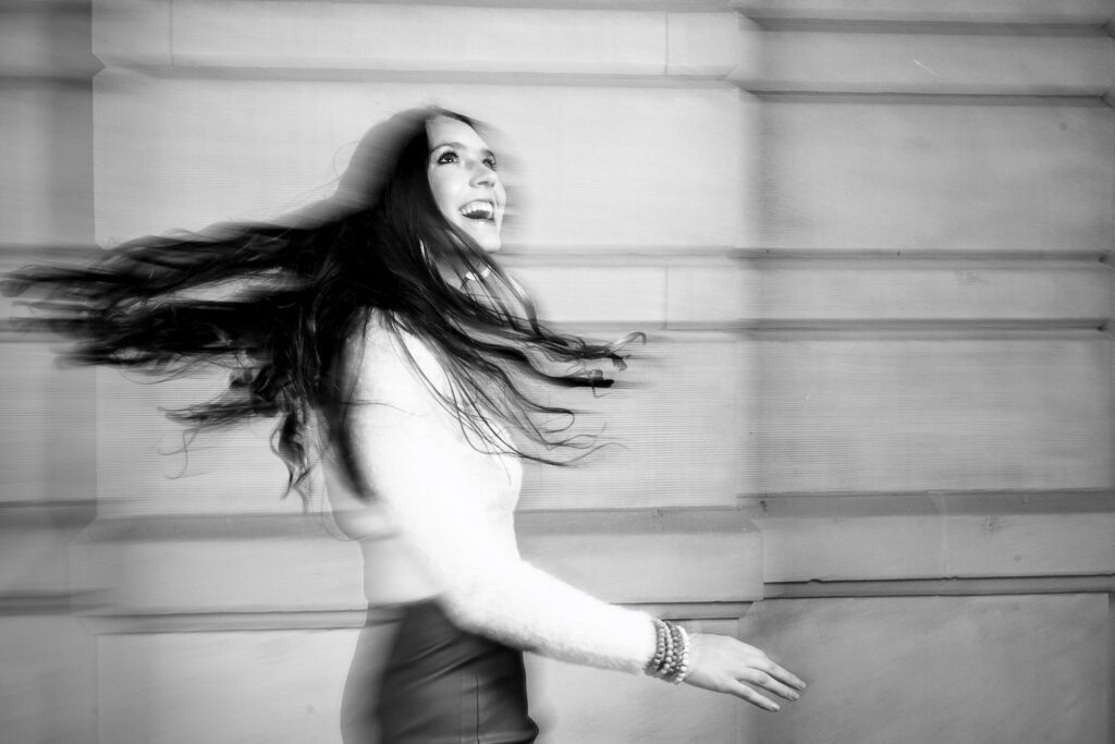 Slow shutter image of senior girl spinning on the mizzou campus