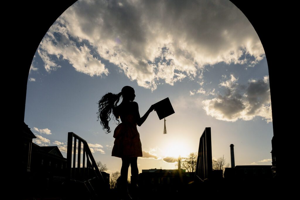 silhouette of college graduate on mizzou campus
