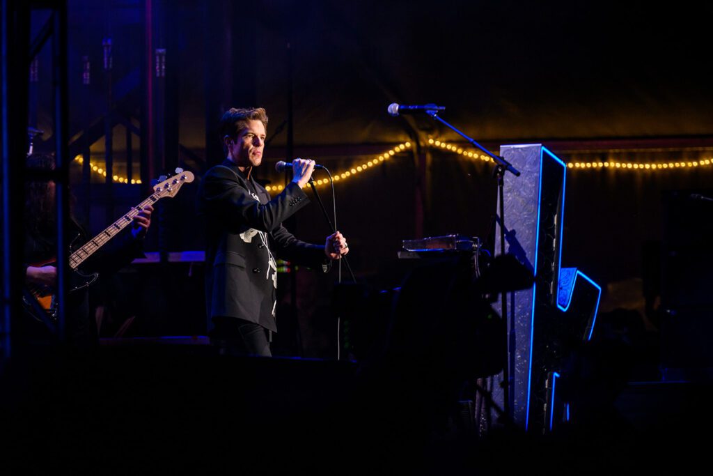 Brandon Flowers of the Killers on stage in suit