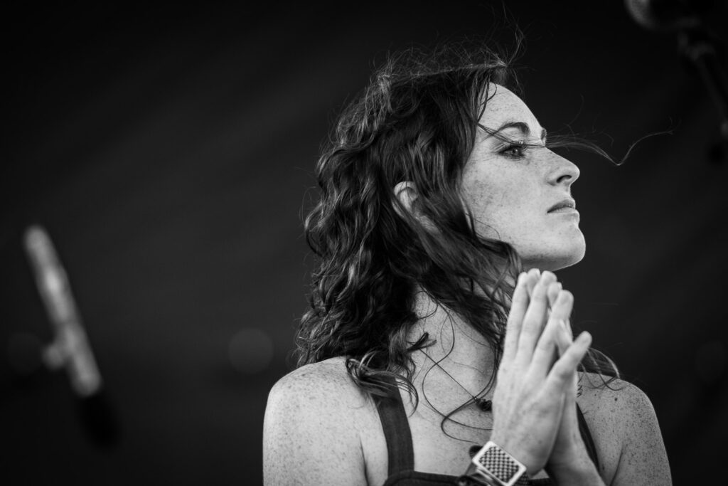 Kristen Camp from the January Lanterns looks off stage during performance