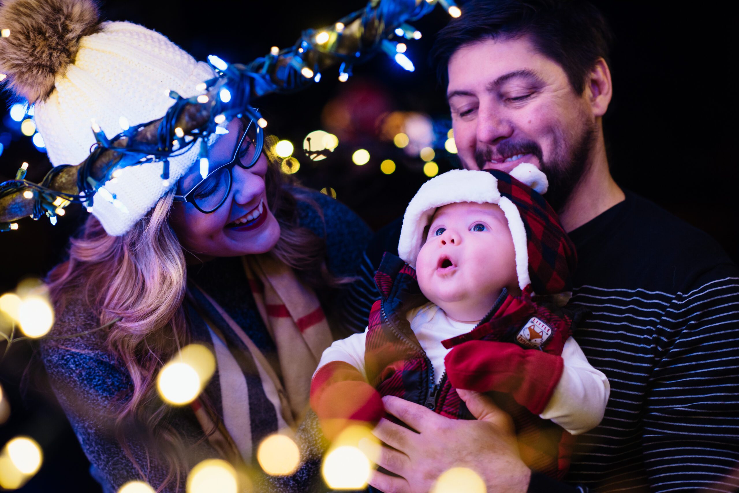 boy looks in wonder at christmas lights