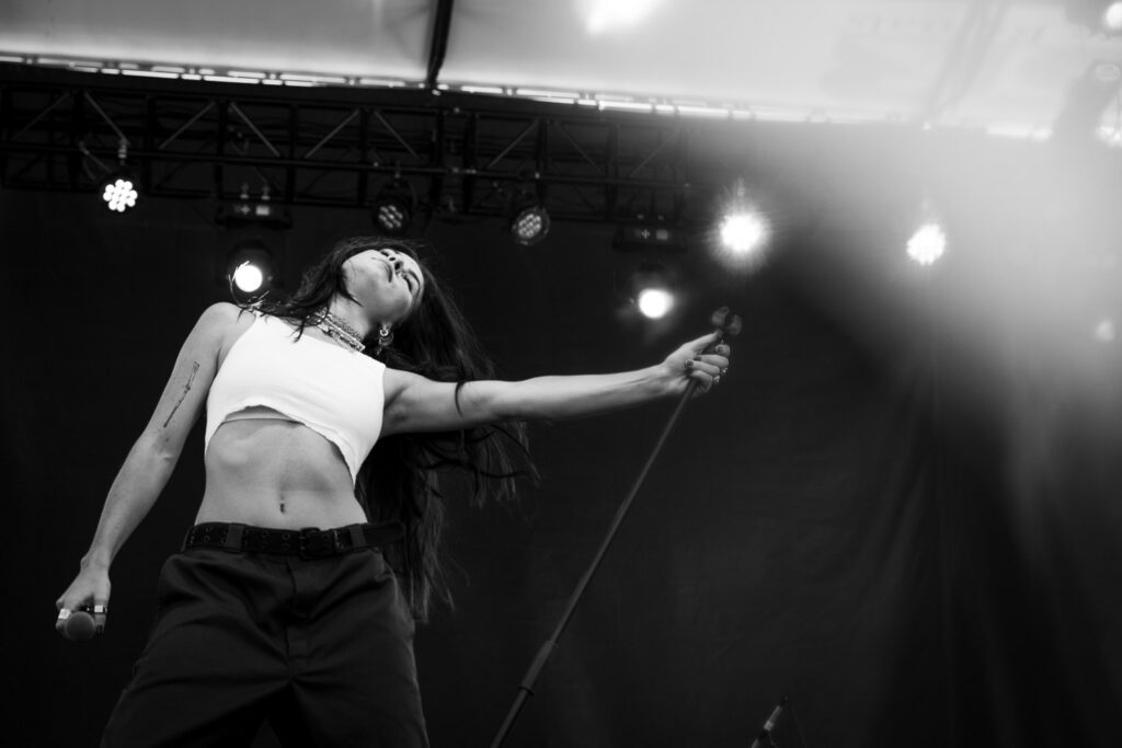 Kassie Ashton feels the music while leaning a mic stand over.