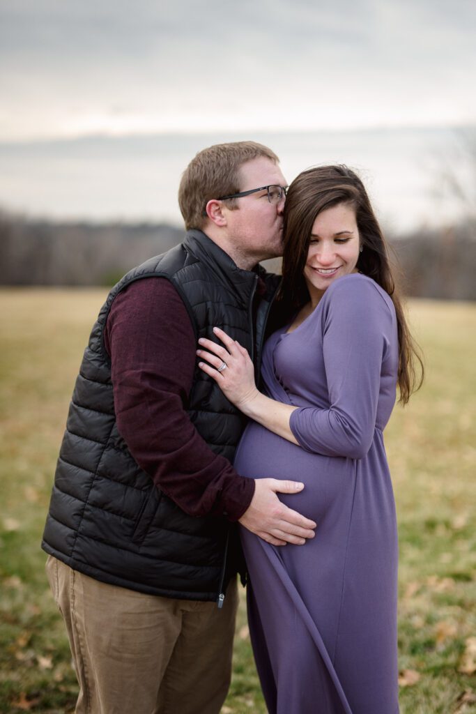 winter maternity session in columbia missouri stephens lake park with purple maternity dress.
