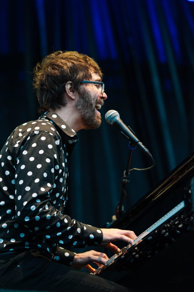 Ben Folds sings while playing piano
