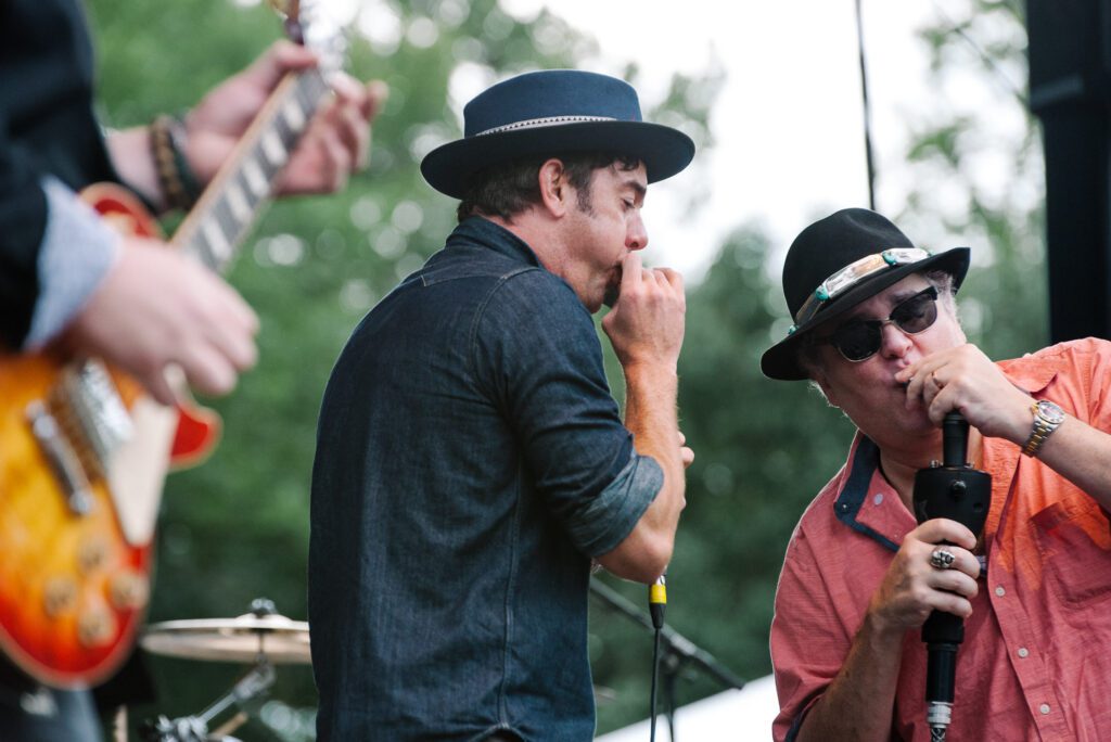 Blues Traveler playing harmonica
