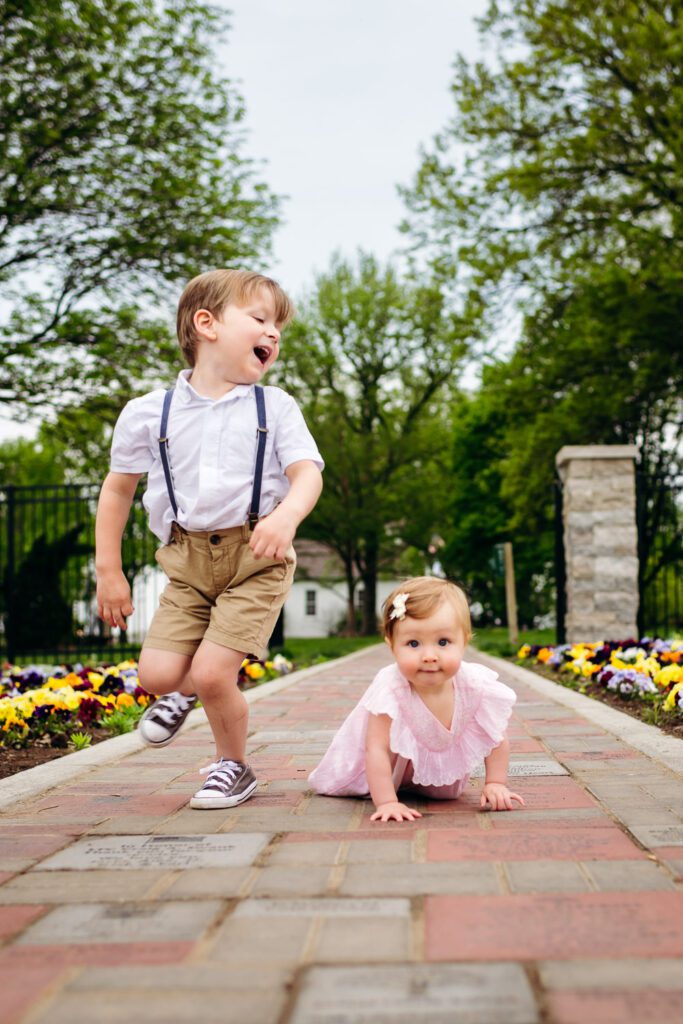 brother and baby sister crawling at shelter gardens