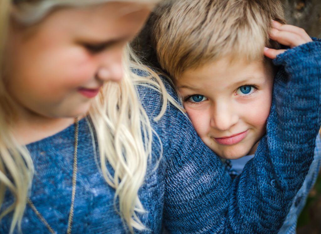 brother and sister blue clothes and blue eyes