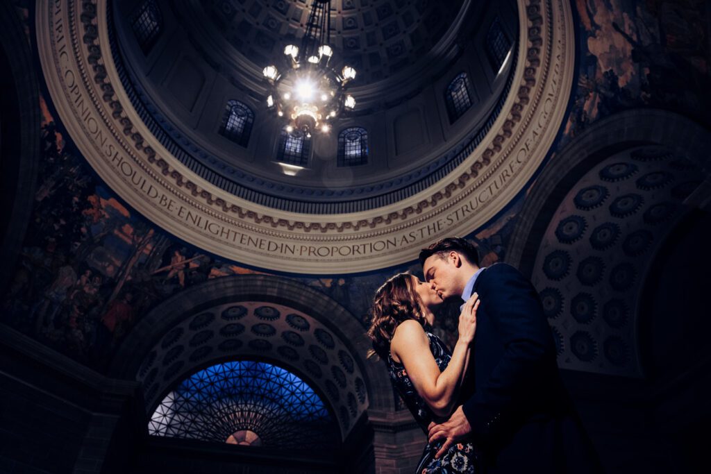 couple kissing under dome in Jefferson City Missouri State Capitol