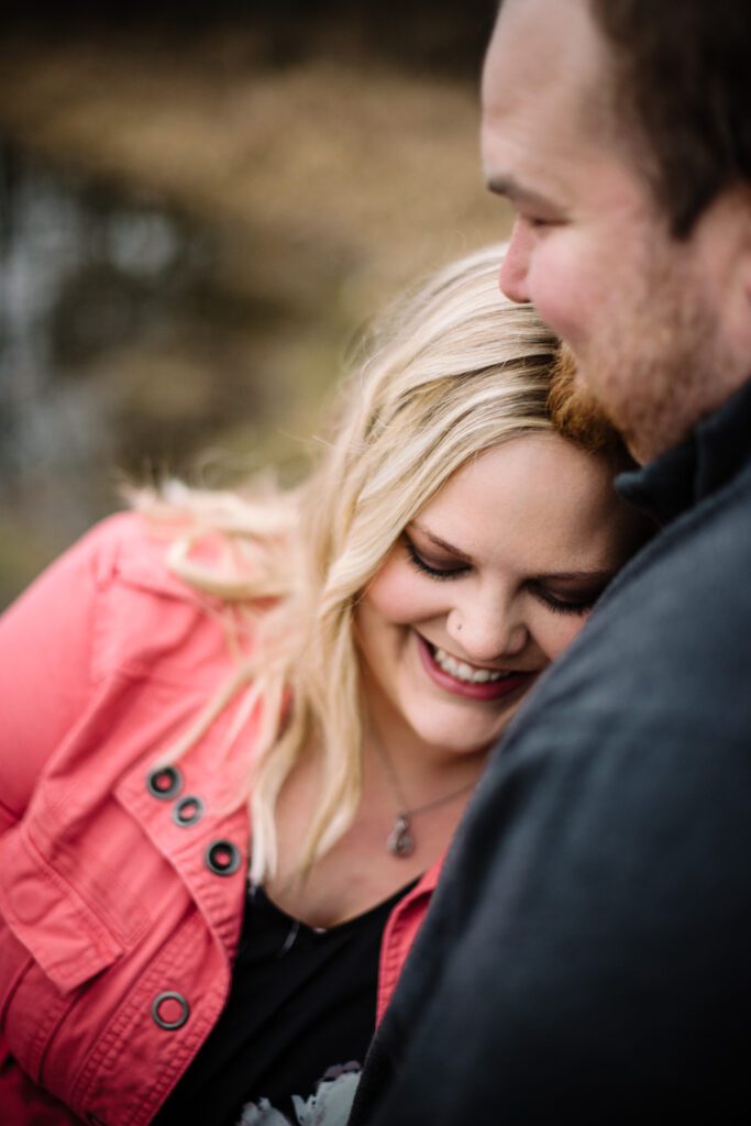 laying head on fiance's chest smiling