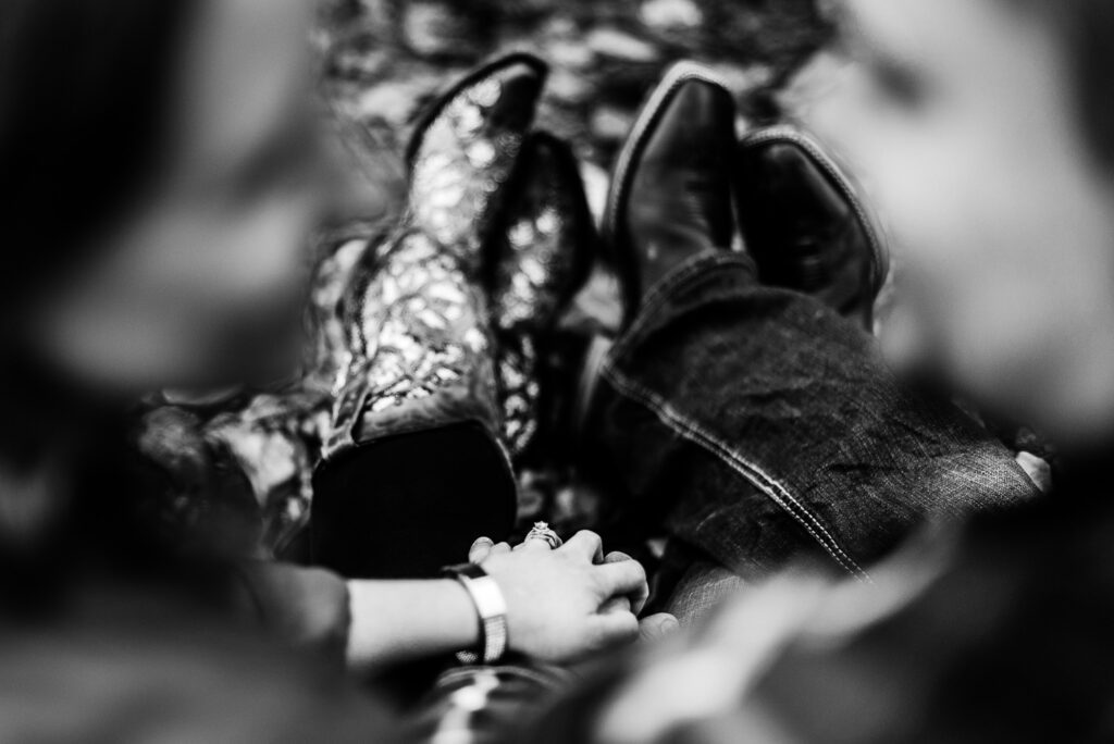 couple with cowboy boots engagement ring