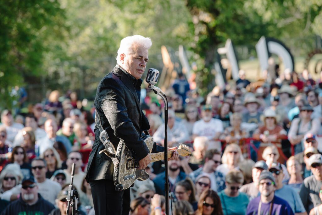 Dale Watson stands before roots and blues festival crowd