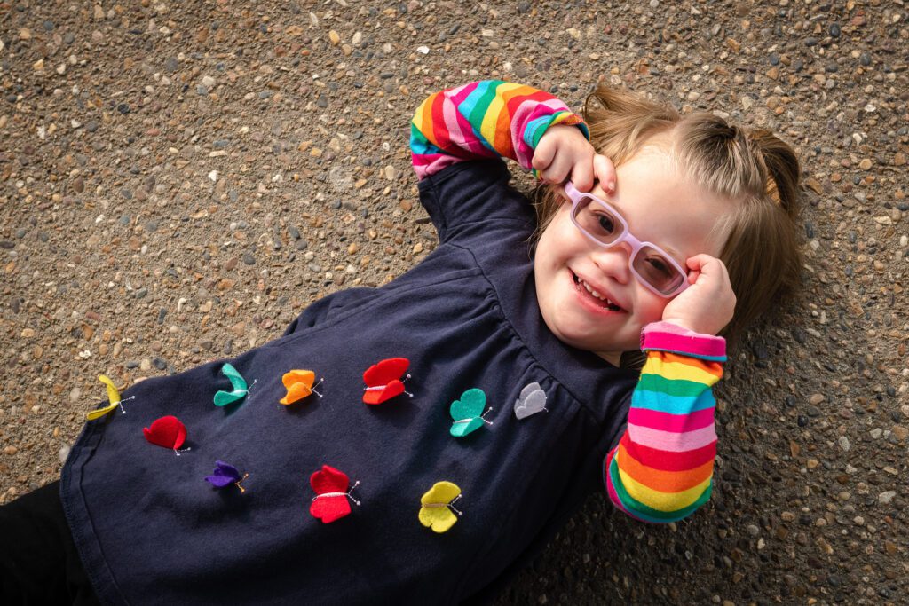 down syndrome little girl smiling with glasses Columbia, MO
